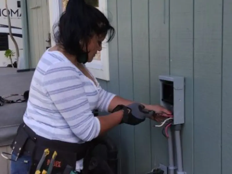 Licensed electrician wiring an exterior subpanel in Shavano Park